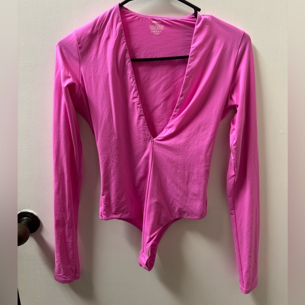 NWT SKIMS SIZE S PINK LS THONG BODYSUIT